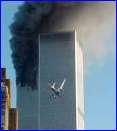 A jet airliner is lined up on one of the World Trade Center towers in New York Tuesday, Sept. 11, 2001. In the most devastating terrorist onslaughts ever waged against the United States, knife-wielding hijackers crashed two airliners into the World Trade Center on Tuesday, toppling its twin 110-story towers. (AP Photo/Carmen Taylor)