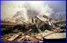 Firefighters make their way through the destruction at New York's World Trade Center after a terrorist attack on the twin towers of lower Manhattan Tuesday, Sept. 11, 2001. In the most devastating terrorist onslaught ever waged against the United States, knife-wielding hijackers crashed two airliners into the World Trade Center on Tuesday, toppling its twin 110-story towers. (AP Photo/Alex Fuchs)